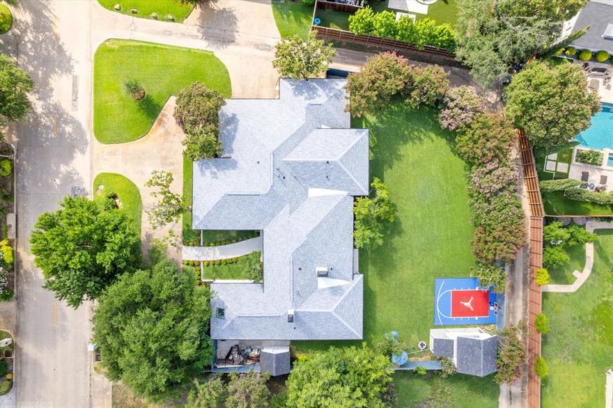 Luxury Living in Prestigious Bent Tree – Remodeled, take down to the studs, One-Story Retreat on .58 Acres!?Welcome to resort-style living in one of Dallas’s most sought-after neighborhoods. Ideally located just minutes from Bent Tree Country Club and Trinity Christian Academy, this meticulously renovated single-story home blends timeless elegance with modern functionality—all on an exceptionally rare, private .58-acre lot. Step inside to soaring vaulted ceilings, abundant natural light, and an open-concept layout designed for everyday comfort and entertaining. New windows, doors, electric blinds, and designer lighting enhance every room with sophistication and style. The chef-inspired kitchen is a culinary dream with a 6-burner gas range, walk-in pantry, custom cabinetry, upgraded lighting, and counter space for prep and hosting. The spacious living area features a cozy fireplace and built-in bar—ideal for gatherings. Retreat to the luxurious primary suite complete with fireplace, private sitting area, dual walk-in closets, and a spa-like bath with soaking tub and oversized shower. The flexible fifth bedroom offers privacy and versatility—perfect as a second suite, office, gym, or in-law space. Additional highlights include a customized laundry room with deep sink, folding station, and built-in dog wash for your furry companions.Exceptional Outdoor Living?Designed for year-round enjoyment, the backyard is a private paradise with 3 covered patios, a fully equipped outdoor kitchen with built-in grill, sink, and a large sport court for play. The detached tiny home—complete with HVAC, water, and internet—is ideal as a guest house, creative studio, or remote workspace. The yard offers plenty of room to add a pool or personalize your dream oasis. Oversized side-entry garage with epoxy floors and ample guest parking complete this exceptional property. This is a rare opportunity to own a turnkey luxury home with unmatched amenities and location in the heart of North Dallas