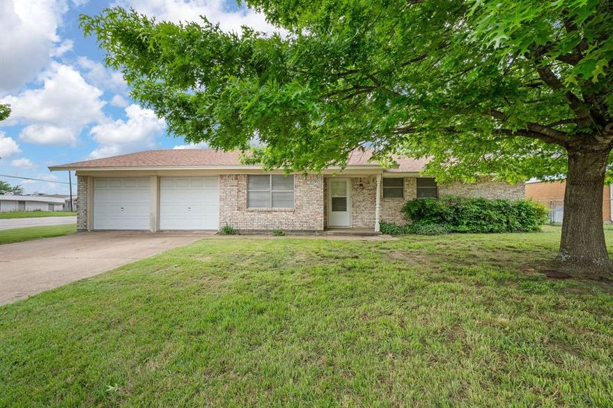 Adorable 3 bedroom, 2 bathroom, and 2 car garage home on a large corner lot.  The tree shaded front yard adds to the cute curb appeal of this home. The house offers a spacious living room with windows overlooking the backyard and is open to the dining area. The kitchen features custom built cabinets and updated countertops. The kitchen has a gas range sure to delight the cook in the family. A huge bonus is the second living area located off the entry that would make a great home office or 4th bedroom. The primary bedroom is a good size and offers an ensuite bathroom.  The home does need new flooring, paint, and some TLC but the price reflects those things.  This would be a great starter home or an investment property.