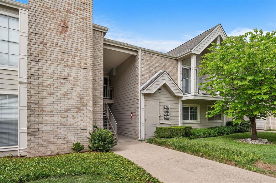 Tucked away in the gated Preston Hills community just off Preston Road this well maintained ground-floor one-bedroom condo is was recently fully painted and is turn key, move in ready. The open-concept living and dining area features hardwood-style flooring, crown molding, flowing seamlessly into an efficient kitchen with granite countertops, white cabinetry, subway tile backsplash, and a breakfast bar with pendant lighting. All appliances convey, including the refrigerator. A stackable washer-dryer in the hallway laundry closet and a dedicated storage closet near the front door makes great use of the square footage. The renovated bathroom features an elegant marble-tiled step-in shower, and the spacious bedroom includes a generous walk-in closet. One assigned covered parking spot is included with ample visitor parking nearby. The HOA is well ran and keeps the community and grounds in excellent condition, with a community pool within walking distance. Location is where this property truly shines -- minutes from the Galleria, Addison dining, and quick access to the Tollway, 635, and 75. The area is also in the midst of an exciting transformation, with a $4+ billion mixed-use redevelopment underway at the former Valley View Mall site just steps away, making this one of the most promising pockets of investment in North Dallas.