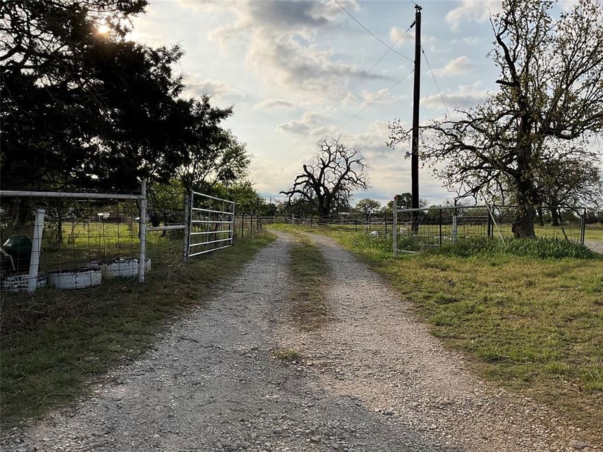 Just over 24 acres of AG Exempt land in beautiful Palo Pinto County, approximately 7 miles southwest of Mineral Wells! Outside the city limits, this property has lots of potential for a homestead with pens and outbuildings to support livestock, poultry, farm equipment and gardens. Property has both co-op water and a well used for outdoors and animals. Older model manufactured home has 3 year old roof and is occupied. Front area of house is fenced off and includes fruit trees and space for vegetable gardens. Back part of property is partially wooded with trails. Boundary lines in photos are approximated. Ground photos of land and improvements available upon request. If your dream is to build a quiet, country life on your own plot of land, this is the place for you!