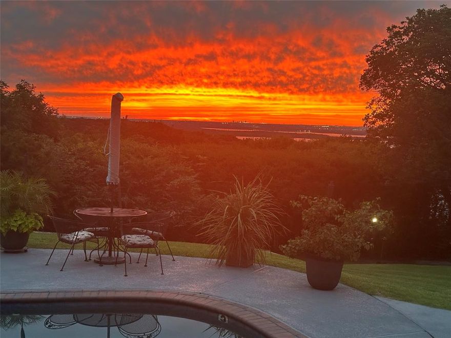 Welcome to a one of a kind gated estate with privacy, exclusivity, serene, natural setting featuring spectacular views of Sunsets, Joe Pool Lake and Downtown Fort Worth! Luxurious and private Primary Suite with a huge walk-in closet, walk-in shower and garden tub, plus a private patio perfect to enjoy your favorite beverage after a long day. Enjoy outdoor entertaining and recreation areas around the sparkling inground gunite pool and covered wood deck with stunning views of Joe Pool Lake and sunset! Elegant Iron door and custom staircase welcomes you when you enter the home. Of the many features of high-quality craftsmanship throughout the home. All living spaces have 1st story views of Joe Pool Lake. Formal living and formal dining areas offer plenty of natural light and are spacious areas for entertaining and comfortable living. Large kitchen features custom cabinets, high end stainless steel appliances and a huge island. Storage building with electricity. Greenhouse for the family gardener. Easy access to DFW airport, downtown Dallas and Fort Worth. Don’t miss your chance to call this truly unique property home!