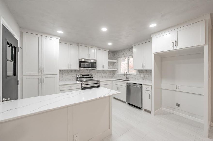 Completely renovated and beautifully remodeled for modern, open living! This home features a brand-new roof, all new water, sewer, and gas lines, and a complete new HVAC system—offering peace of mind and long-term value. The kitchen shines with 42-inch custom cabinetry, quartz countertops, and all new appliances, while the bathrooms have been fully upgraded with stylish finishes.

Refurbished hardwood floors and fresh paint throughout give the home a bright, like-new feel. Enjoy the freedom of no HOA in this thoughtfully updated, move-in-ready property with convenient access to I-635, I-30, shopping, dining, schools, and more.

4518 Live Oak Dr. offers three bedrooms and two full bathrooms with a versatile layout that includes a formal sitting room, an open dining area flowing into the kitchen, and a sunken den highlighted by a striking stone-faced fireplace. Multiple living spaces, plus a bonus loft (not included in sqft) area, provide flexible options for work, play, or relaxation.

Outside, enjoy a covered front porch, rear patio, fenced backyard, corner lot, and a two-car side-entry garage. This home truly lives like a new build—schedule your showing today and submit your best offer.