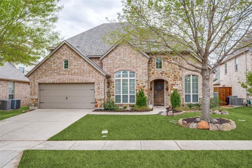 Welcome to the desirable community of Stonewater Crossing, with highly sought-after Frisco ISD, conveniently located off Stonebrook Parkway and FM423 with easy access to North Dallas Tollway and SRT121, minutes from The Star, Legacy West, Stonebriar Mall, Toyota Stadium; all the shopping and dining your heart desires are at your fingertips, one of the best locations to be in Frisco for ease of access. This stunning two-story impeccably maintained Highland Home is ready for its next owners. The moment you arrive you will be greeted with lush landscaping and beautiful mature trees and stone border flower beds. Step inside and you will enjoy the hardwood floors to the main living areas. Formal dining perfect for entertaining in the holidays. Executive study with double doors to add a sense of privacy when working from home. A family room with cozy stone featured fireplace with cedar mantel. Gourmet kitchen with painted glazed cabinets. Granite countertops with island. Stainless steel appliances including a gas cooktop, pantry, and breakfast nook perfect for your morning coffee. Powder bath for visitors. Primary bedroom with en suite with dual vanities with quartz countertops, garden tub, separate shower and walk in closet. Upstairs you will enjoy three well-appointed bedrooms with closets and two full bathrooms. The game room is ready for playing pool and a media room for watching your favorite movie. Outside you will enjoy a stone built in outdoor kitchen. Covered patio and a pool worthy size lot to enjoy the summer. Three car garage finishes this home off to perfection.