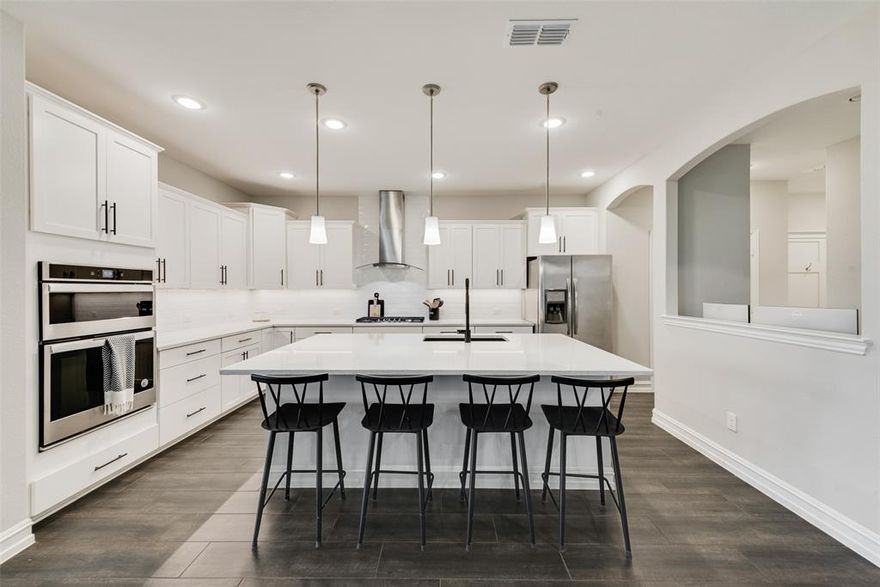 Welcome home to this beautifully maintained 4-bedroom, 3.5-bath residence in Haslet. A dramatic entry with vaulted ceilings opens to a spacious flex room perfect for a home office, formal dining, or an additional sitting area. The heart of the home is the open-concept living space, anchored by an oversized kitchen island—ideal for seamless entertaining. The chef's kitchen boasts granite countertops, a gas cooktop, and abundant cabinet and storage space. A convenient planning desk tucked off the kitchen provides a great spot for homework, crafting, or a quick office nook.
Upstairs is a true haven, featuring a large gameroom and connected media room—a perfect 'kid cave' or mancave. Three secondary bedrooms and two full baths offer generous space for a large family or maximum privacy for guests. The private primary suite is perfectly situated on the main level and includes dual vanities and two walk-in closets, one of which offers flexible space for a second office, exercise room, or crafts. Storage is never an issue with clever details like a walk-in storage area under the stairs (great for a coat closet or seasonal decor). Enjoy the outdoors from your covered back porch overlooking an oversized yard with no back neighbors. This home provides ultimate convenience, located within walking distance of elementary, middle, and zoned high schools, and is just a short drive to the Alliance Center and I-35W for an effortless commute. Don't miss the opportunity to make this amazing home yours!