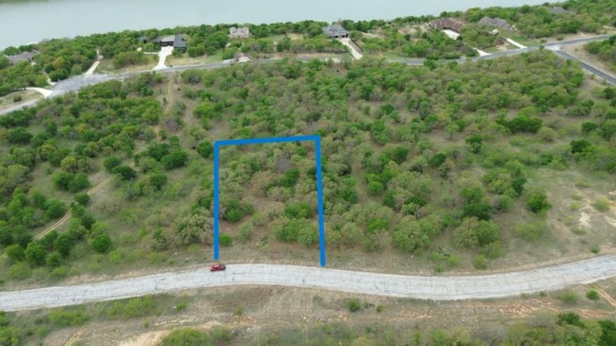 Build your dream lakeside retreat on this prime acre lot within the gated North Star Pointe community, boasting elevated views of 12,000-acre Lake Bridgeport, mature trees, and a serene creek; enjoy exclusive amenities including a private pool, boat ramp, sports courts, and the tranquility of abundant wildlife, all with the convenience of paved streets, city water, and underground utilities, creating an ideal setting for both peaceful living and outdoor recreation.