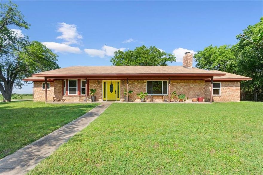 Charming Country Retreat with Space to Breathe! Escape the hustle and discover this peaceful 4-bedroom, 3-bathroom brick home nestled on a secluded, over-sized lot. Tucked away in the countryside, this well-maintained property offers the perfect balance of privacy, comfort, and convenience. Step inside to find a warm, inviting layout with an overly spacious living area, large windows for natural light, and a cozy fireplace that's perfect for relaxing evenings. The kitchen features numerous cabinets, storage, and an abundance of counter space, making it ideal for everyday living and weekend entertaining. Outside, enjoy quiet mornings on the covered front porch and room to roam in the open yard, surrounded by mature trees. The detached barn offers extra storage or hobby space—bring your chickens, tools, or dreams of a mini homestead! Just the right distance from town for peace and privacy, but still close enough for an easy commute or trip to the store. This is country living at its finest. Don't miss this unique slice of country charm!