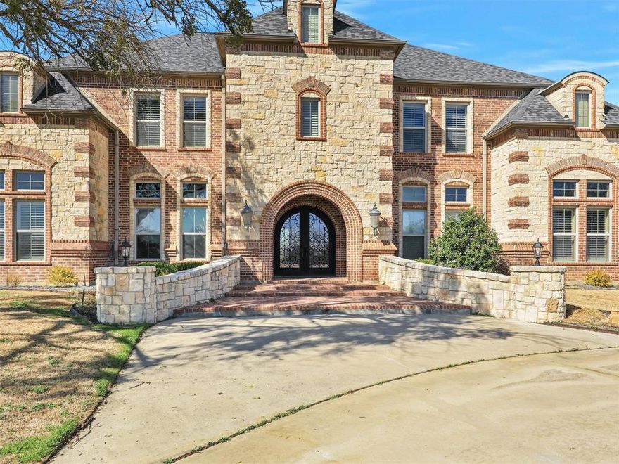 26.042 acre ranch that offers the perfect balance of luxury functionality! 10,585 square feet of living space, 5 bedrooms with ensuite, 3 half baths, wine room, workout room, commercial grade kitchen, 3 fireplaces, formal dining, upstairs library, media room, elevator, hand crafted wood floors, game room with kitchen and bar, trophy room, kitchen has double ovens, ice maker, 2 dishwashers,commercial refrigerator and freezer, large stone fireplace in family room. 5 stall barn,feed room, tack room, hay storage, bathroom, outside covered parking for horse trailer and motor home with hook ups. several paddocks pipe fencing, gated stone entry, bronz horse sculptures at front of property and in front of the barn.  Additional 35.331 acres available 20914988 MLS