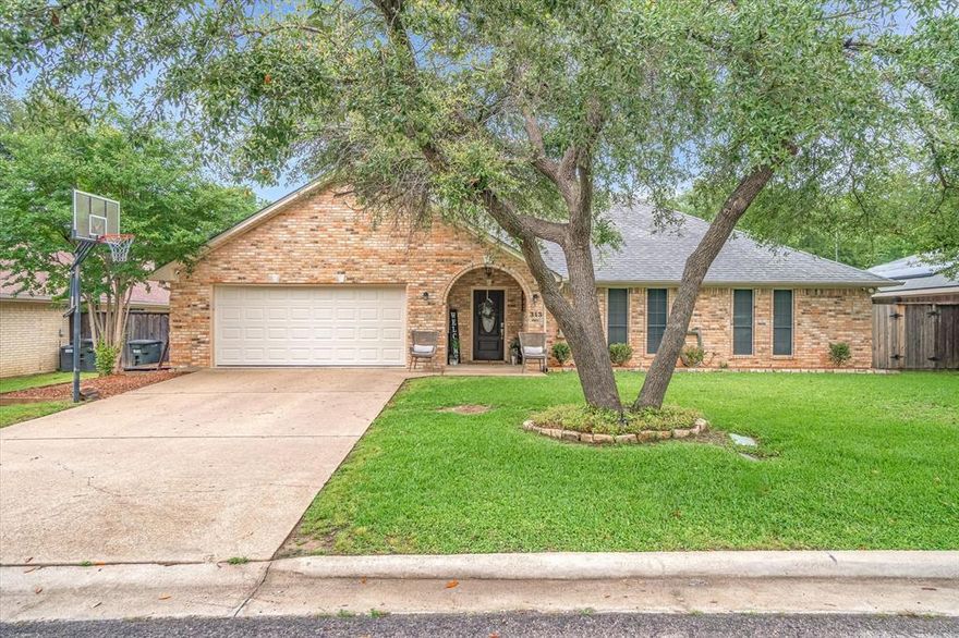 Beautiful home in highly desirable Highland Addition neighborhood in Wills Point. This home has tons of curb appeal with nicely maintained landscaping and gorgeous arched entryway.  Warm inviting floors and neutral gray walls lead you into the large living area with tall ceilings. The open dining area with upgraded lighting is perfectly situated next to the granite peninsula with additional seating options. The kitchen is bright and airy and leads to a laundry room complete with a sink. Down the hall you will find two good sized secondary bedrooms with walk in closets! The hall bath has an oversized vanity great for sharing space in the mornings. The primary bedroom is spacious and ensuite bath has double vanity and bath shower combo.  Bonus feature is a cedar lined walk-in closet! The fully fenced backyard is private and the home has a large covered patio to enjoy.  Don't hesitate to view this home that is just minutes from schools, grocery and restaurants.  Showings start 5-14