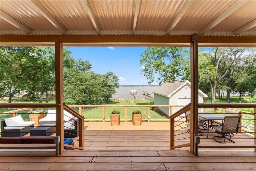 Wide Open Water with Unbeatable Depth!  SELLER'S IS OFFERING SELLERS CONCESSION, CALL FOR MORE INFORMATION!! This immaculate 3 bedroom, 2 bath lakeside retreat offers incredible wide open water views and remarkable water depth, bring your measuring tape! Thoughtfully updated and move-in ready, the home is full of custom finishes and unique touches throughout. From electric fireplaces and built-in shelving to creative headboard designs, every detail adds character and comfort.  Inside and out, this home delivers. Enjoy lake life from the large covered porch that provides shade all day long, or gather around the firepit for year-round fun. Take in the sweeping waterfront views from the fire pit or retreat to the 12x24 fully insulated workshop, complete with electricity and HVAC: perfect for hobbies, storage, or could be adapted for guest overflow.  Best of all, no restrictions means you can enjoy the property on your own terms. Whether you're seeking a weekend escape,  full-time waterfront haven, or a short term rental, this property checks every box and the unforgettable sunset views are the icing on the cake.  The Seller is ready to move on to their next adventure!