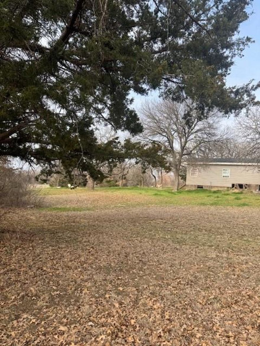 Amazing opportunity with owner financing available to own three private and secluded acres in Decatur, TX which is an ever growing community with expansion all round North Texas, however, this slice of heaven is still tucked away from all the hustle and bustle and offers maximum privacy in a community with custom built homes on multiple acreage parcels. Subject property is an ever expanded double wide mobile home that has been professionally added onto by a builder, per the seller, and offers seven bedrooms, three bathrooms, two living areas and a nice comfortable and very functional kitchen. A portion of the property is leased to tenants who pay approximately 1,000 a month in rent. The property is serviced by two electric meter boxes, one well and septic system. A new composition roof was added about eight years ago. The owner has created this property into a duplex, which is where the tenants live in a two bedroom one bath portion of the property, the rest is a single family property. The tenants are on a month to month basis and would love to stay but would need a thirty day notice to move after closing. The land is beautiful with a pond at the front, completely fenced on all sides and flat with no flood. This is the opportunity you have been waiting for to own a piece of paradise in a quiet area with country living all around. Farm animals allowed including chickens. Make that move you have always wanted to do and get out of the city and let your country roots grow! There isn't a survey available.