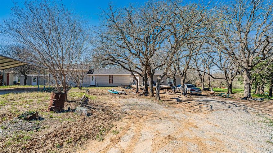 Amazing opportunity with owner financing available to own three private and secluded acres in Decatur, TX which is an ever growing community with expansion all round North Texas, however, this slice of heaven is still tucked away from all the hustle and bustle and offers maximum privacy in a community with custom built homes on multiple acreage parcels. Subject property is an ever expanded double wide mobile home that has been professionally added onto by a builder, per the seller, and offers seven bedrooms, three bathrooms, two living areas and a nice comfortable and very functional kitchen. A portion of the property is leased to tenants who pay approximately 1,000 a month in rent. The property is serviced by two electric meter boxes, one well and septic system. A new composition roof was added about eight years ago. The owner has created this property into a duplex, which is where the tenants live in a two bedroom one bath portion of the property, the rest is a single family property. The tenants are on a month to month basis and would love to stay but would need a thirty day notice to move after closing. The land is beautiful with a pond at the front, completely fenced on all sides and flat with no flood. This is the opportunity you have been waiting for to own a piece of paradise in a quiet area with country living all around. Farm animals allowed including chickens. Make that move you have always wanted to do and get out of the city and let your country roots grow! There isn't a survey available.