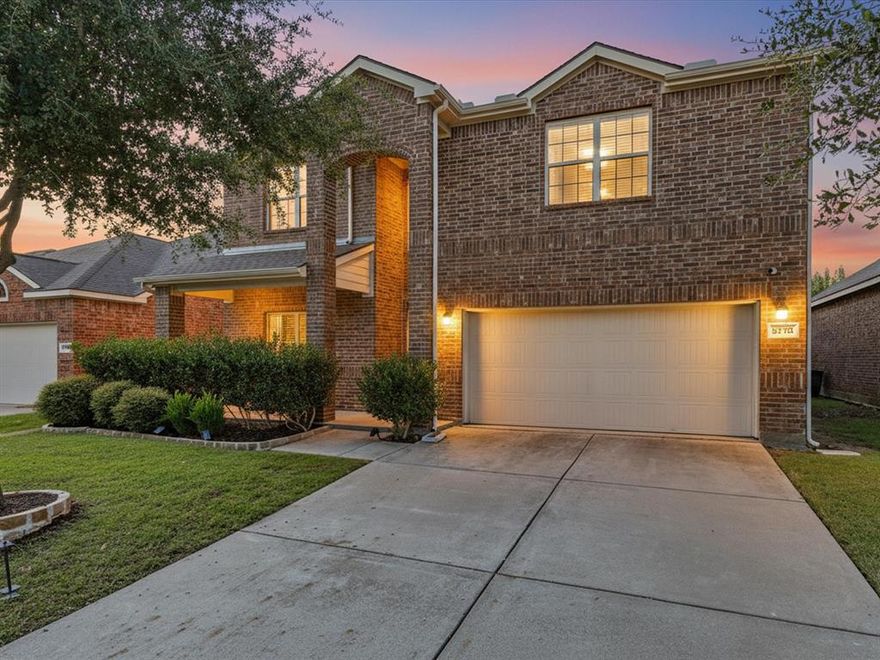Sequestered on a desirable interior lot, this stunning two-story home boasts a charming front porch, a beautiful and relaxing pool with waterfall feature, and recent updates including a 2021 roof and gutters! Step inside to a grand entry that opens to a versatile formal living or dining space. The expansive living room impresses with a cast stone fireplace and a wall of windows that flood the home with natural light. The inviting kitchen offers a raised breakfast bar, granite countertops, a center island, 2021 tile flooring, and a sunlit breakfast nook. A full-size utility room with built-in cabinetry adds convenience. The private first-floor primary suite is generously sized, offering space for a sitting area and a spa-inspired bath complete with dual sinks, a garden tub, separate shower, and walk-in closet. Upstairs, discover a huge game room, ideal for a pool table plus plenty of space for your flat screen to enjoy movie night at home. Spacious secondary bedrooms include a private guest suite downstairs and two additional guest rooms upstairs, providing comfort and flexibility for family and guests. Step outside to your own backyard oasis featuring a covered patio, board-on-board fence, and a pergola that overlooks the sparkling pool, perfect for entertaining or relaxing in style. Amazing community with 2 pools, walking trails, catch and release pond and playgrounds! Minutes from Little Elm and close enough to all of the exciting new attractions in Frisco including The Star, PGA golf courses and the upcoming Universal Kids Resort!