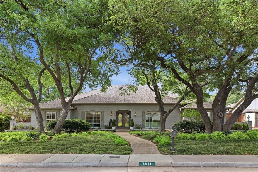 Original owner custom built by Shaddock Homes, this exceptional single-story home is located in the highly sought-after Highland North neighborhood & feeds into acclaimed Richardson ISD schools including Bowie Elementary, Parkhill Junior High & J. J. Pearce High School; just a few blocks away. Stunning curb appeal welcomes you with majestic oak trees, lush landscaping & elegant double leaded glass front doors. Upon entering, your eyes are immediately drawn through expansive windows to the sparkling pool & outdoor living space beyond. To the right of the entry is a spacious living area with glass doors ideal for a private office or third living area, while the formal dining room sits to the left. Both rooms feature wood flooring. The oversized family room is the heart of the home with custom built-in bookshelves, rolling library ladder, rich wood details & a marble fireplace surround. Custom cabinetry in the kitchen & family room showcases quality craftsmanship. The updated kitchen offers granite countertops, painted cabinetry, island, Thermador double ovens & a Dacor gas cooktop. Adjacent breakfast room features a wood-beamed ceiling & backyard views. The primary suite is filled with natural light & offers an updated bath with granite countertops, a large California Faucets WI shower & 2 walk in closets featuring California Closets systems. Two secondary bedrooms share a full bath on the same wing as the primary suite. A separate living area off the kitchen is ideal for a media room, game room or flex space. This wing also includes a private guest bedroom & full bath, perfect for multigenerational living or long-term guests. Step outside to enjoy the oversized patio, private backyard & impressive 33,000-gallon diving pool. Additional features include a storage building, two 240V EV outlets in the garage, Pella windows installed in 2010 & a Class 4 impact-resistant roof installed in 2017. Conveniently located near shopping, restaurants, parks, George Bush & US-75.