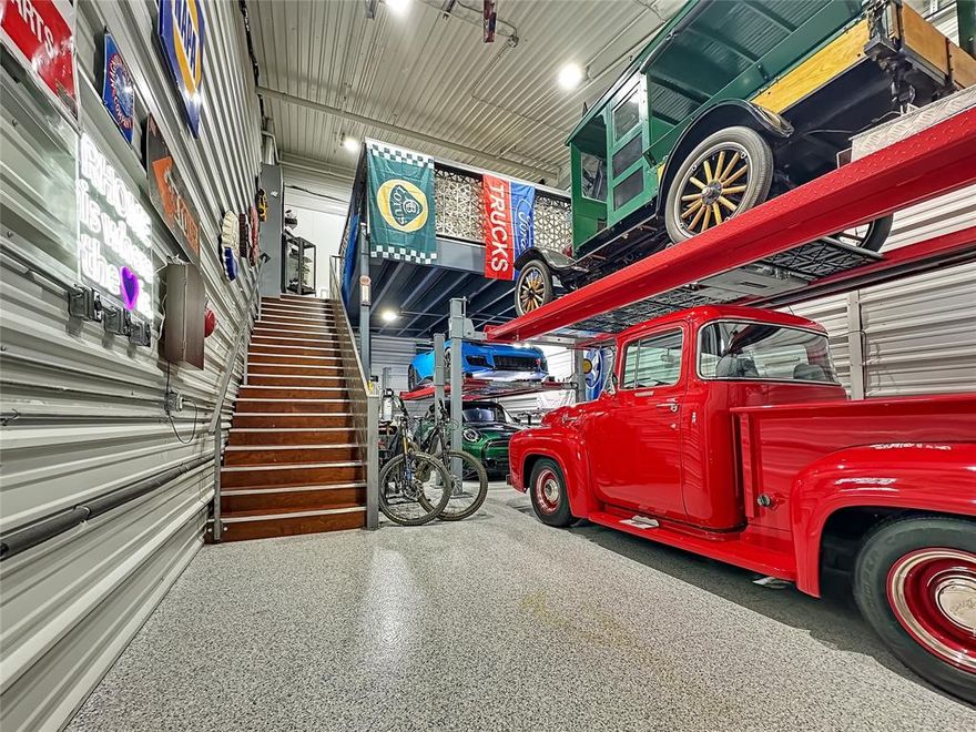 Secure a RARE opportunity to own one of DFW’s most premium flex spaces at Garages of Texas, perfectly designed for car collectors, enthusiasts, or small business owners. Suite D09 combines luxury, functionality, and security, offering an elevated space for storage, work, and entertainment.
Whether you’re showcasing a prized car collection, pursuing personal hobbies, hosting clients and friends, or running a small HVAC, plumbing, or specialty business, this property delivers unmatched versatility in a highly sought-after community.

D09 is 20x40 on the lower level including a storage closet and a bathroom with a tankless hot water heater. Entire unit is insulated and cooled and also has two oversized 5 blade fans to assist with cooling throughout the space. 

The upstairs loft is 13x14 & has a kitchenette with a sink and fridge as well as a working desk area, large white board space and a sitting area with a sofa, coffee table and TV that conveys. 

Newly updated LED light system that turns an ordinary garage in to something special at night with endless possibilities to design the perfect atmosphere along with the whole garage sound systme to highlight the beautiful cars.
Property Highlights:
Two hydraulic Advantage Lifts:
DX9000XLT – 16’8”
DX9000HD – 14’7” with rolling hydraulic jack
Entire space is insulated and air conditioned
Sprinkler system for safety & compliance
Luxury entertainment upgrades: Harmon Kardon sound system for whole shop coverage
Brand-new 75” LG TV & three Arlo security cameras.
Furniture included & memorabilia and signs negotiable
Bathroom & tankless hot water heater for convenience
Clubhouse access for private events & gatherings
HOA fees: $203.95 per month
This unit is not zoned for residential living, ensuring a professional and private environment. Garages of Texas offers a secure, well-maintained facility  making it a hub for collectors and entrepreneurs alike.
Measurements approximate and to be verified by buyer