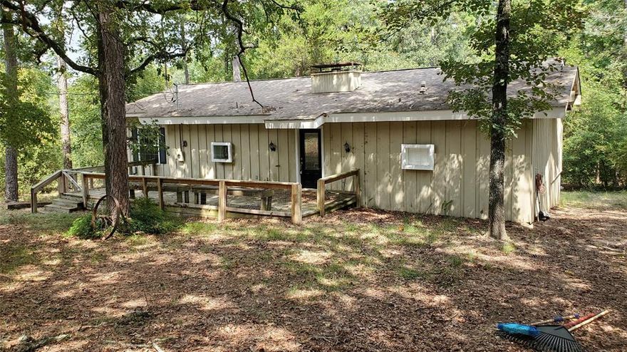 Escape to the country in scenic and relaxing Holly Lake Ranch. PRICED TO SELL and ready for your personal touch, this charming home offers a stunning view of the natural surroundings via the floor-to-ceiling windows that extend the entire length of the house.  Full of natural light, the open floor plan features a wood-burning fireplace for that cozy atmosphere, two spacious bedrooms with ensuite baths, double vanity in master and large walk-in closets.  Conveniently located off the master bedroom is the extra large laundry room with walk-in closet for additional storage.  Located on a nicely wooded lot and close to community amenities with storage shed in back yard.  Holly Lake Ranch is a highly desired gated community with on-site security, 18-hole golf course with pro shop, driving range, restaurant & bar, pickleball, tennis and basketball courts, miniature golf, disc golf, dog park, swimming pool, club house, fitness center, walking trails, and two lakes that offer fishing, boating, kayak, canoe. The surrounding area offers many dining and shopping options, medical care within 15 minutes, and 30 minutes from Tyler or Longview.  Whether you're looking for a weekend retreat or permanent residence, this home offers all the serenity of the Piney Woods but convenient access to city amenities. Information provided by Seller & Listing Agent deemed reliable but not guaranteed and should be verified by Buyer and Buyer's Agent.