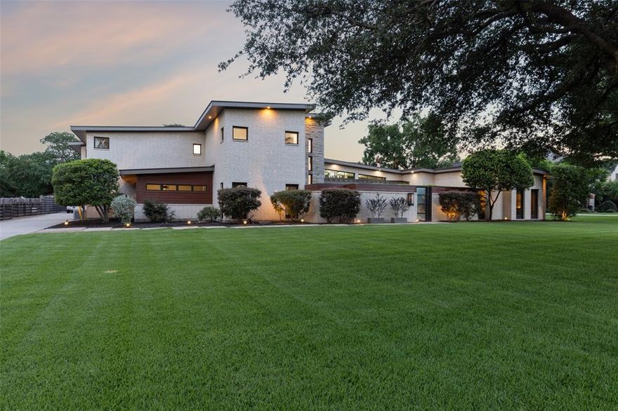 Escape to this luxury modern retreat with striking architectural design, incorporating sleek styling & abundant natural light. You're greeted by an open floor plan with stunning views of the large backyard & pool. The layout seamlessly integrates the living, bar, dining, & kitchen areas, creating an ideal space for relaxation & entertaining. Chef's kitchen features upscale appliances, sleek cabinetry, large island, walk-in pantry & butler's pantry. First floor has theater, gym & a bonus room that can be used as an office or lounge. The primary bedroom is a sanctuary with fireplace, sitting area & coffee bar. The en-suite bathroom is spa-like with dual shower, free-standing tub, & spacious custom closet spaces. Second floor features 4 oversized bedrooms, a game room, a laundry room, and two AC’d storage rooms. Entertain effortlessly on the patio with a built-in grill, mini-fridge & fireplace. This is a unique gem of a home that offers the perfect blend of comfort, style & convenience.