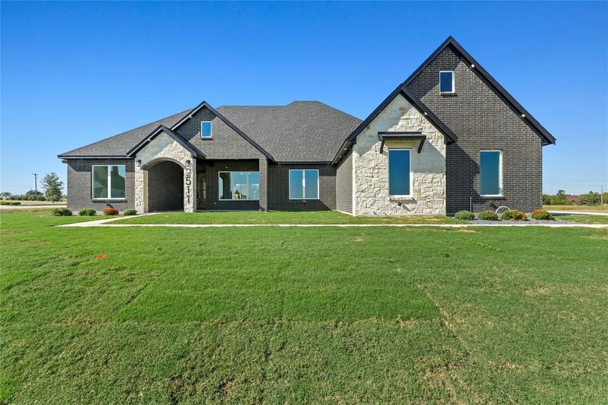 Builder offering 4.99% FIXED RATE! Experience luxury living in the heart of Waxahachie with this custom new build on a full 1-acre lot. Enjoy a spa-like primary en-suite, chef's kitchen, and Texas sized covered patio perfect for entertaining. This beautifully crafted home showcases exceptional attention to detail and luxury at every turn. Featuring custom white oak cabinetry, soffit lighting encircling the exterior, and double 8-foot wood-stained doors, every element exudes elegance and craftsmanship. Inside, you’ll find an open-concept layout highlighted by sliding glass doors, accent walls in the office, master suite, and half bath, and built-ins for a refined yet functional touch. The chef’s kitchen offers under-cabinet and top lighting, a hidden pantry, and sleek design elements perfect for entertaining. Retreat to the primary suite, complete with a sitting area and a spacious walk-in closet. The custom master bath is truly a spa-like escape, boasting double sprayers, double jets, and dual rain-fall shower heads set over a marble stone shower pan. Additional highlights include a sprinkler system and high-end finishes that make this home one of a kind. home qualifies for special rate with our preferred lender and exclusive builder incentives, don't miss out!