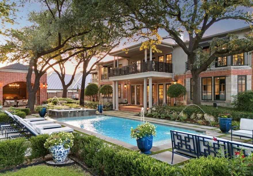 An exceptional offering and value in the heart of Old Preston Hollow’s estate area—priced BELOW appraised value and set on over 1 acre of resort style grounds. The expansive 9,953 sq ft main residence offers 6 bedrooms, 8 baths + an additional 1,250 sq ft 2024 guest house w 2 ensuite bedrooms, full kitchen, living-dining areas, covered terrace + walk-in laundry. Newly reimagined, guests are welcomed through a soaring 24 ft foyer anchored by grand dual staircases w floor to ceiling windows and well appointed living-dining rooms w matching 20ft FPs. Designed for grand-scale entertaining, the home features 3 tandem living areas, including a central salon w imported antique stone FP and Italian stone columns, walk-in bar finished in black marble that flows into the relaxing lounge + charming 25 ft keeping room off of the kitchen. The European kitchen is a showpiece: marble countertops + backsplash, dual sinks + dishwashers, pot filler, lighted display cabinetry- w a lighted silver display closet and a large working pantry w 2nd side x side fridge-freezer + abundant storage. A large media room, 2 oversized marble powder baths, fitness room, which can double as an additional bedroom. The exceptional primary retreat is complete w marble spa bath, heated floors, steam shower, standalone tub, an expansive custom closet + 2 balcony terraces viewing back yard. A separate in-law suite mirrors the primary layout. Outdoors, the estate unfolds with multiple covered terraces, pool and spa, jetted water features, hardscape terrace along w space for sport court or putting green. The adjacent cabana is fully equipped with 2nd kitchen w 2 dishwashers, green egg, floor-to-ceiling stone fireplace, remote screened living + dining areas, ceiling heaters - perfectly suited for seamless year round indoor-outdoor living. Additional features include five-car motor court, extra parking, 2023 roof. A rare opportunity and value to own in the distinguished neighborhood and private school corridor.