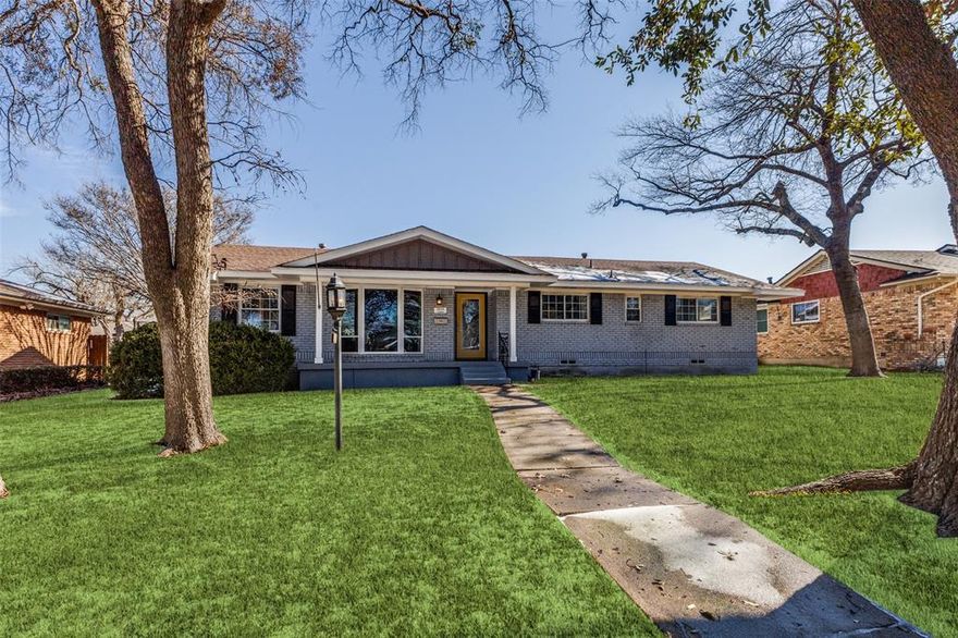 Exciting opportunity to make this charming open concept and remodeled home your forever home  with a close in location to downtown Dallas. Sitting proudly on a tree shaded grassy lot in a quite sought after neighborhood.  This lovely home offers an open concept floor plan, white marbel entryway into the formal living, dining and kitchen areas, a centrally located fireplace in the living area, 3 bedrooms and 2.5 baths, real hardwood floors throughout, Remodeled baths have tiled floors and granite countertops. The kitchen is spacious with gas range, white cabinetry and dramatic black granite countertops, plus a breakfast area and a built in desk with cabinets. All baths are remodeled with granite countertops, tiled floors and bath tub and shower enclosures.  A large WIC is offered in the primary ensuite bedroom. There is a lovely modern chandellier in the dining area creating a warm ambiance.  Lots of natural lighting cascade throughout the living areas.  The backyard opens  through beautiful French Doors onto a wood fenced backyard and patio for entertaining or just chilling out after a long day at work.   Easy access to shopping, dining, retail stores, conveniently located nearby in Arboretum Shopping Center and White Rock Lake and park just minutes away.