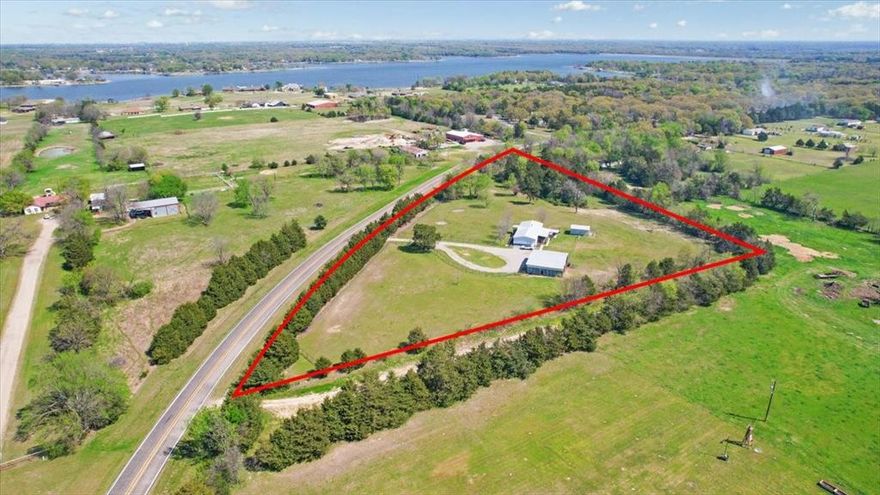 Set on 3.9 beautifully maintained acres just minutes from Bonham State Park and Bonham Lake, this fully fenced property offers the perfect blend of country living and convenience. Ideally located near shopping, dining, and medical facilities in Bonham, with an easy commute—approximately 45 minutes to McKinney and 35 minutes to Sherman. The tree-lined acreage provides privacy and a peaceful setting, ready for horses or livestock. A spacious 38' x 35' pole barn with 13' height offers ample room for trailers, RVs, and equipment, and includes horse-livestock stalls. Additional improvements include an 18' x 20' carport and a 24' x 14' storage building. Outdoor living shines with a 25' x 12' covered back porch deck—perfect for entertaining or relaxing while taking in scenic views—plus an additional covered concrete patio and a charming 10' x 10' paver patio. Inside, the home features generously sized rooms, a cozy propane fireplace, and French doors that open wide to the back deck, creating seamless indoor-outdoor living and inviting in the fresh country breeze.

Additional Notes: Seller will have the home leveled prior to closing. Swing and gas stove excluded (stove will be replaced). Other non-realty items available for purchase