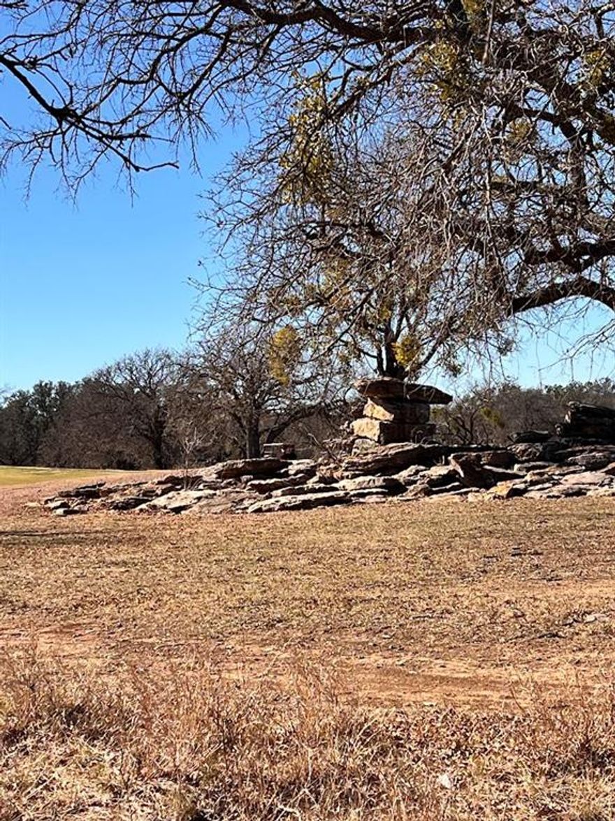 Interior Lot 591 on Breezy Street in the desirable King’s Point Cove Resort Subdivision offers an excellent opportunity to build your dream home in Central Texas. This nicely sized lot features approximately 83 feet of road frontage, a fairly level terrain, and multiple attractive building sites. The property adjoins The Hideout Golf Course and is conveniently located near Lake Brownwood. Water, electricity, and sewer are available. As an owner you can enjoy four free rounds of golf per month on the 18-hole Championship Hideout Golf Course, along with reduced rates for the RV park, cabins, and ranch house. Enjoy unlimited access to resort amenities such as two swimming pools, hot tub, playgrounds, sand volleyball court, driving range, putting green, fishing pond, resort lodge, restaurant, and more. A private community boat dock on Lake Brownwood adds even more recreational opportunities. An ideal golf course lot in a resort-style community. Once your dream home is built, family and friends will be lining up to visit—whether it’s for golf, lake days, BBQs by the water, or simply relaxing and enjoying the lifestyle. They’ll be envious (in the best way) as you enjoy living in one of the most beautiful and amenity-rich areas of Central Texas.