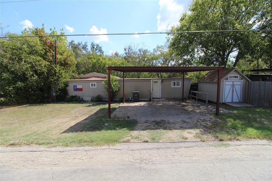 Welcome to 329 Longhorn Trail in Weatherford, Texas — a fully updated single-wide manufactured home on nearly a quarter acre of owned land with peaceful country charm and modern upgrades throughout.

This 1-bedroom, 1-bath, 900 sq. ft. home has been beautifully refreshed with fresh paint, new flooring, and brand-new stove, offering a bright, move-in-ready interior. The open-concept design makes the space feel roomy and inviting — perfect for comfortable living or a weekend getaway.

Outside, the property truly shines. The land is nicely cleared, featuring a huge backyard, a brand-new two-car carport, a large storage shed and workshop, and an older steel storage building for additional space. Relax by the new stone fire pit or enjoy the tranquil sounds of the creek running along the back of the property — a rare find in this area.

With no park fees or lot rent, you own both the home and the land. Conveniently located just minutes from Weatherford’s historic downtown, shopping, and dining, this property combines small-town peace with easy access to city amenities.

Whether you’re a first-time buyer, downsizing, or looking for a serene retreat with space to breathe, 329 Longhorn Trail is ready to welcome you home.