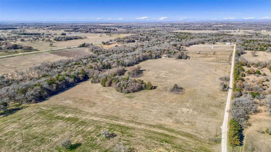 Beautiful 25+ acre tract in Grayson County featuring gently rolling terrain, a desirable mix of open pasture and mature woods, and a scenic creek running along the west side of the property.  Multiple elevated build sites offer flexibility for your dream home, weekend retreat, or small ranch setup each offering peaceful views and privacy. The land supports abundant wildlife, including deer and turkey, creating a quiet, natural setting ideal for country living.  Accessed by a shared private road, this property offers seclusion while remaining just minutes from Lake Texoma and very close to the Rock Creek area. Located in Whitesboro ISD.  Currently ag-exempt for hay production and wildlife management. Not located in a floodplain. Partially fenced along the north boundary (neighbor’s fence).  Deed restrictions are in place to preserve the integrity of the area, including single-family residential use and no mobile homes helping ensure a consistent, quiet environment without high-density development.  No utilities are currently installed.  Electric will need to be run from the road, as well as a well and septic system installed allowing you to build and design to your exact specifications.  A rare opportunity to own a peaceful, well-protected piece of North Texas land in a highly desirable area.