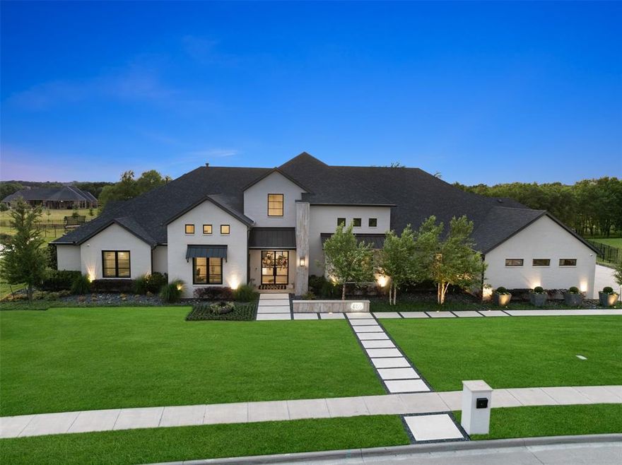 Experience luxury living in award-winning Mustang Lakes community. This exquisite single-story estate sits on 1.631 acres of tranquil, tree-lined backyard. Offering privacy, space, and elegance designed for refined living and resort-style entertaining. Soaring ceilings, designer finishes, and an open-concept layout welcome you into a grand living space with california style sliding glass doors that seamlessly blend indoor and outdoor living and entertainment. Your private oasis awaits, enjoy year-round entertaining with a covered grill station, fireplace, outdoor heaters, fans, motorized drop-down screens, sunken fire pit, sparkling pool and spa, cabana, and lighted putting green. The gourmet kitchen is a chef’s dream, featuring quartzite countertops, Wolf range, walk-in prep kitchen with ice maker  and spacious butler pantry.  The serene primary suite offers a spa-like bathroom and oversized custom closet with built-in storage and secondary laundry. A vaulted-ceiling office and a full gym add flexibility for both work and wellness.

A tech lover’s paradise, the home boasts a professionally installed $42K+ smart home and media system with a Klipsch 7.1 Dolby theater, Dragonfly 120 inch screen, Denon receiver, 8-channel observation hub with remote access, video doorbell, touchscreen controls, in-ceiling  - in-wall speakers, and premium Samsung displays - even outdoors and in the gym.  Other highlights include epoxy-coated garage floors, a tornado shelter, security system with cameras, golf simulator net, and professional landscaping by AquaTerra.

Mustang Lakes offers a 12,000 sq ft clubhouse, resort-style pools, fitness center, tennis courts, scenic trails, stocked lakes, and HOA-maintained front yards - all within top-rated Prosper ISD. Ideally located just minutes from DNT.  Quick access to Frisco, Legacy West, PGA Headquarters, fine dining, boutique shopping, & world-class entertainment.  Do not miss this exceptional home.