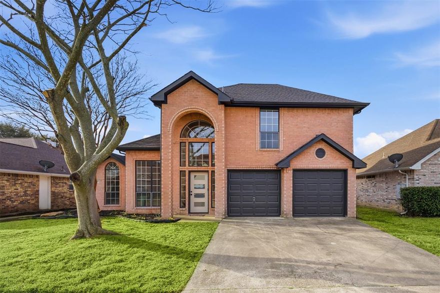 This spacious 4-bedroom, 2-bath home offers 2,038 sq ft of comfortable and stylish living space, perfectly situated just a quick 20-minute commute to Dallas. Step inside and be greeted by soaring ceilings and an abundance of natural light pouring through beautiful arched windows, setting a warm and inviting tone.  The open floor plan centers around a spectacular double-sided fireplace that connects the expansive kitchen and living room, creating a cozy yet sophisticated focal point. The chef in your home dreams about a kitchen like this —featuring all new cabinets with sleek black hardware and luxurious 3 cm quartz ct. Tons of countertop space for both cooking and entertaining! Downstairs, two bedrooms provide convenient living options, while upstairs you’ll find two additional bedrooms along with a versatile landing area that can serve as a play zone or home office. The primary bath has been beautifully updated with a modern glass-enclosed shower for a spa-like experience.  Step outside to a fenced backyard complete with two storage sheds, perfect for garden tools, seasonal decor, or extra storage needs. Whether you’re entertaining guests, relaxing with loved ones or commuting into Dallas, this move-in ready home blends practicality with charm, offering a lifestyle of comfort and convenience.