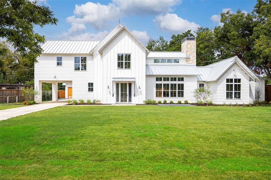 TIMELESS ELEGANCE - This elevated farmhouse in Casa Linda Estates is set on nearly half an acre now listed below the appraised value! This new construction stunner is a seamless blend of luxury, comfort, and style—step inside to the inviting interior, adorned with clerestory ceilings, bathing the space in natural light. The primary bedroom and study on the main level, provide a private oasis.The centerpiece of the living area is a grand stone fireplace that rises through the roof, creating a captivating focal point that anchors the home. Upstairs, find three well-appointed bedrooms and a spacious game room. The interior exudes a sense of casual elegance, with thoughtful design and high-end finishes.Outside, the home boasts a standing seam metal roof, Quaker windows, and a drive-through porte-cochère. A detached three-car garage provides ample space for parking and storage. Situated near White Rock Lake and providing an idyllic setting for enjoying the best that Dallas has to offer.