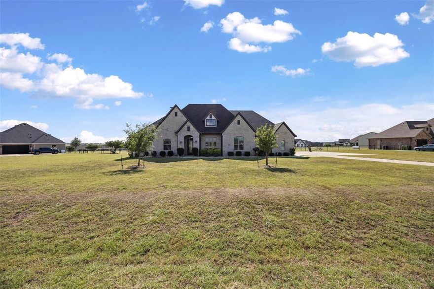 Built in 2020, this stunning 4-bedroom, 3.5-bath home with a 3-car garage offers modern comfort and Texas charm in the sought-after Starlight Ranch community of Godley. Set on over an acre, you’ll enjoy open spaces and rolling pastures just a short drive from Fort Worth via Chisholm Trail Parkway or Hwy 377. Inside, designer finishes and an open floor plan make everyday living and entertaining effortless. Step outside to a spacious patio with an outdoor kitchen and fireplace—perfect for gatherings or relaxing in your private retreat.