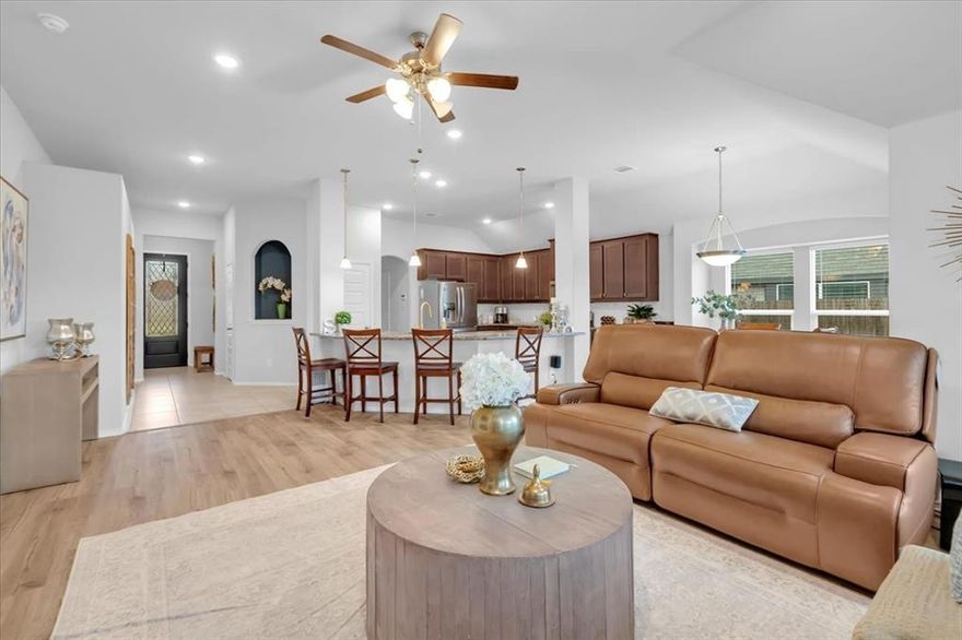 MOTIVATED SELLER! Welcome to 1200 Queens Brook Lane, a 2021-built home offering 3 bedrooms, 2 baths, and 1,730 sq. ft. of modern living. This open floorplan features luxury vinyl plank flooring, abundant natural light, and an open-concept kitchen with stainless steel appliances, a large island with seating, a walk-in pantry and laundry room. The split primary suite is privately located away from secondary bedrooms and includes vaulted ceilings, dual sinks, a soaking tub, and a spacious walk-in closet. Smart home features include app-controlled lighting, security, and a programmable thermostat. Enjoy outdoor living with a beautiful, recently-added covered patio and oversized backyard. Enjoy lower electric bills and long term savings with energy-efficient solar panels. Situated on a desirable corner lot with great curb appeal and convenient access to shopping, dining, and major commuter routes. Move in ready and priced to sell! Schedule a tour today!