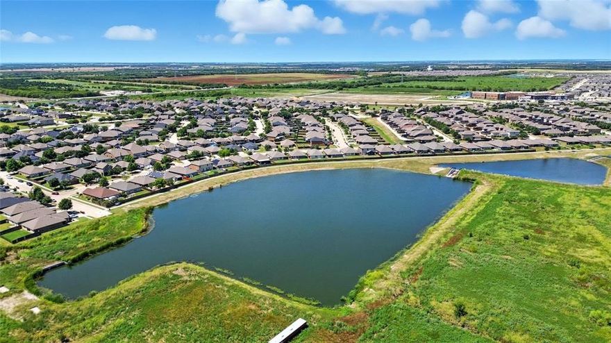 Welcome Home to the highly sought after community of the Verandah! Just around the corner from the new Ruth Cherry Elementary School! Enjoy an active lifestyle with the community pool, splash pad, playground, jogging-walking paths, as well as catch and release fishing from the huge neighborhood pond, all within walking distance! Beautiful, barely lived in one story - pride of ownership - clean!!! Washer, dryer and refrigerator all convey with sale of property. The popular open concept floorplan includes 3 nice sized bedrooms. Primary bathroom has large walk-in closet and spa like features. Eat-in kitchen boasts stainless steel appliances including a gas cook top.  You will love the oversized backyard with stone wall - space is perfect for entertaining or play! Elementary school in neighborhood. Community offers ponds, pool, and park.