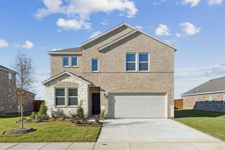 This beautifully crafted 5-bedroom, 3-bath home, built in 2024, offers exceptional curb appeal with its charming brick and stone elevation and pretty landscaping. Inside, the home features an open concept floorplan with wood-look floors, recessed lighting, and neutral colors throughout. The kitchen is a chef's dream with white cabinets, a large center island with a breakfast bar, stainless steel appliances, and a walk-in pantry, all open to the spacious living room with a tray ceiling that adds a touch of elegance.

The primary suite is conveniently located on the first floor and offers a tranquil retreat with its own tray ceiling, a dual sink vanity, walk-in closet, and a spacious stand-alone shower. Another guest bedroom is located downstairs, split from the master for added privacy. Upstairs, you’ll find three more generously sized bedrooms and a game room, perfect for family entertainment.

Washer, Dryer, and Refrigerator included!

Step outside to the covered patio, where you can relax and enjoy the views of the greenbelt behind the home, made even more scenic by a wrought iron fence. The Madera community offers excellent amenities, including a sparkling swimming pool, playground, two amenity centers, and a cozy community fire pit. Zoned for the highly-rated Northwest ISD, this home is ideally located near the Alliance Corridor, Texas Motor Speedway, and DFW International Airport, providing easy access to shopping, dining, and entertainment. Don’t miss the opportunity to make this gorgeous home yours!