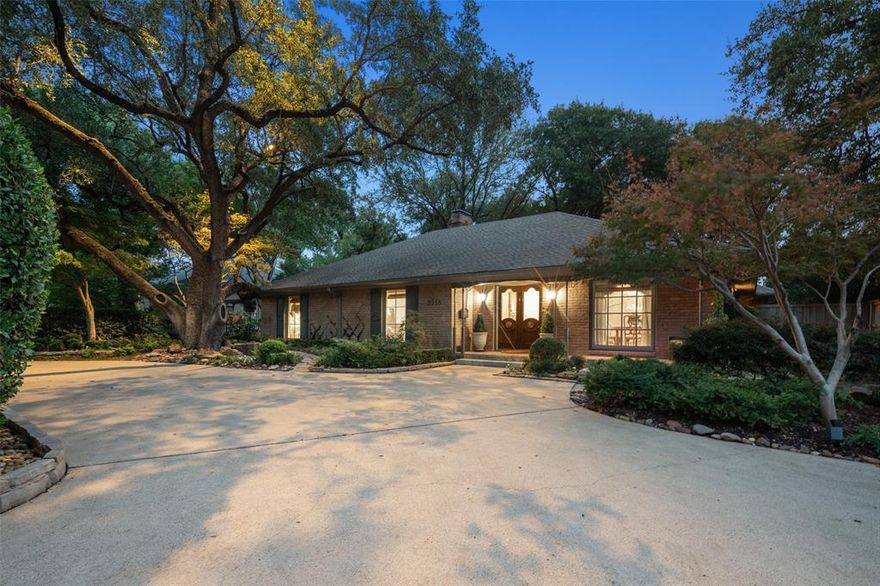 Elegantly renovated jewel box is nestled beside West Highland Park in one of Dallas's most sought after neighborhoods. Conveniently located, it is a short stroll through timeless, expansive neighborhoods and impeccable parks to luxury shopping and fine-dining restaurants in Highland Park Village.  Home was classically designed and renovated; kitchen updates include Wolf brand gas cooktop and oven, Carrara marble counters, lighted, custom kitchen cabinets and drawers with soft close design, Baldwin hardware, and farm sink with Newport Brass fixtures. Breakfast nook features Carrara marble waterfall along the built-in banquette. Formal dining room showcases an antique mirrored wall and Gracie wallpaper.  Oak and herringbone patterned hardwood and marble flooring through-out the home, accented with custom wood moldings and paneling.  Two open-concept family rooms with skylights, fireplace with gas logs and sconces, painted paneling, and walls of windows that showcase a lushly, landscaped, garden under a canopy of mature trees, with a large antique brick patio area for entertaining guests.  Home also features a large primary bedroom suite with French doors opening on to the outdoor living oasis. Luxurious guest bedroom suite is a dream of wall to wall blue and white, Gracie wallpaper, and has a lighted, walk-in closet designed by California Closets. There is also a Cedar lined closet in Hallway for additional storage. Home also has an oversized two car garage with an electric gate to driveway and front circular driveway for guests. Home has a Trane HVAC system. The roof was replaced in November 2024., and the water heater was replaced in 2025. Your dream lifestyle awaits in this coveted home and neighborhood. Conveniently located within close proximity to Highland Park Village, Inwood Village, both with lots of shopping and restaurants and close to Dallas North Tollway, and Love Field Airport.