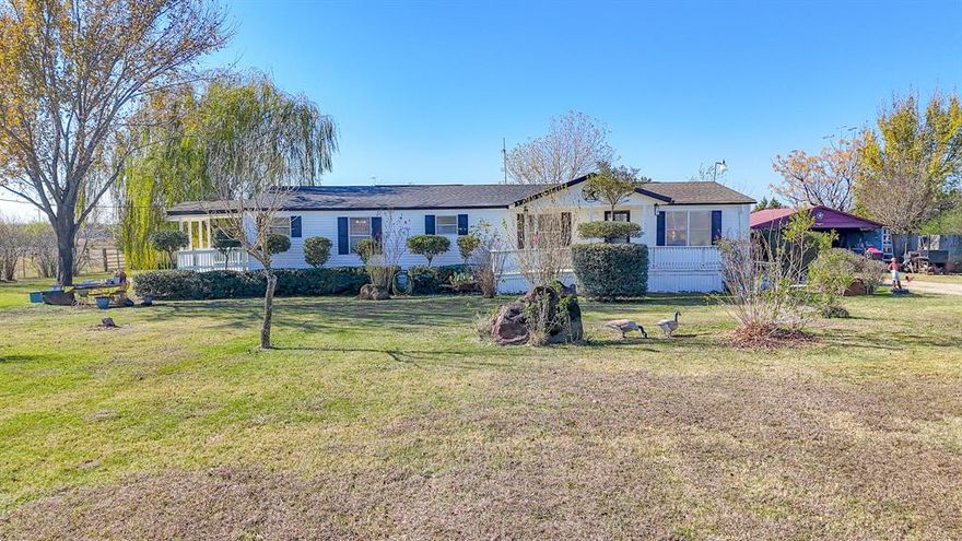 Enjoy peaceful country living on this fully fenced corner lot featuring nearly 9 ag-exempt acres in Kerens, TX. This spacious 3-bedroom, 2-bath doublewide offers a comfortable, easy-flow layout and a large back porch—perfect for relaxing or taking in the sunset. The seller is willing to leave the refrigerator, washer, and dryer, and the farm equipment is negotiable. The property also includes multiple outbuildings for storage, livestock, or hobbies, along with a small pond that adds extra charm. With plenty of space, privacy, and possibilities, this is your own slice of Texas country living.