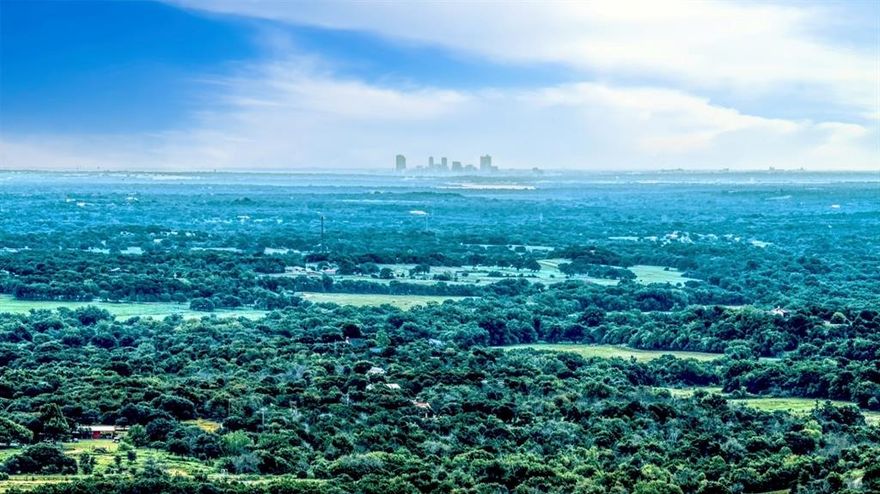 Historic JD Kutch-Elder Ranch – 947± Acres. NE Parker County, Texas
This exceptional ranch offers a rare blend of history, natural beauty, and convenience. Ideally located between Weatherford, Springtown, and Azle, with paved frontage on Upper Denton Rd and Veal Station Rd, it’s just 30 minutes from Fort Worth and 5 miles from Lake Weatherford.
Situated on one of Parker County’s highest points, the ranch boasts panoramic views—including the Fort Worth skyline. Rolling hills, mature live and red oaks, and abundant water sources including the headwaters of Silver Creek, Ash Creek, Pecan Creek, natural springs, five stock tanks, and four water wells make this property truly unique.
The land is cross-fenced into three main pastures, two holding pastures, and two horse traps, with a 70-acre cultivated field. Native grasses such as Big Bluestem and Indian Grass are thriving due to excellent land stewardship. Wildlife is plentiful—deer, turkey, quail, dove, and duck—offering exceptional recreational and hunting opportunities.
Improvements include a 1937 two-story sandstone home full of rustic charm, a large barn, new pipe working pens, a loading chute, and a 50-ft round pen.
Minerals: Seller retains all mineral rights.