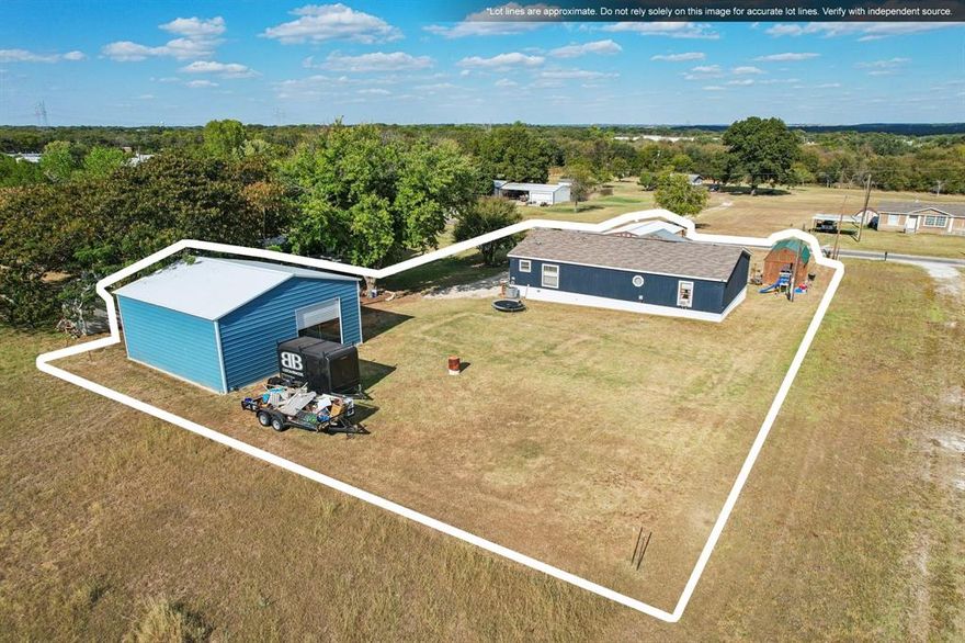 Brand new Class 3 Architectural shingle roof installed February 2026! Brand new skirting December 2025. Stop the Car! Look at all this home and property has to offer! Like new one owner manufactured home located on a very nice .45 acre lot just a short walk from the Brazos River! 2 car carport AND a 30X30 detached metal shop on slab with 2 metal roll up doors and electricity! Large covered and screened in front deck porch perfect for sitting and relaxing AND a separate cedar siding, metal roof storage building! Welcome home to 7712 River Run located just minutes from everything Granbury has to offer! This is an amazing 1 owner 32X52 doublewide, featuring 3 bedrooms, 2 baths, 1664 square foot, and built in 2015. Inside you will find plenty of comfort. Large living room with ship lap accent wall and ceiling fan. Large and functional kitchen just off the living room offers a great breakfast bar, full appliances, plenty of cabinets, and great views out the many windows. Cozy breakfast area just off the kitchen is perfect for the family meals. Great utility room has plenty or room and hookups for a full size washer and dryer as well as space for a freezer if needed. Large master bedroom with ensuite master bath. Master bath features double sinks, separate garden tub, and separate walk in shower. Bedrooms 2 and 3 are very roomy and feature plenty of closet space for the kids. Very functional guest bath with wood laminate flooring. Outside you will find your oasis! Sit and relax on your private covered and screened in front deck porch. After relaxing you can walk over to your own personal 30X30 metal shop on slab with electricity. Ready to mow the almost half acre lawn? Find your lawn equipment in the separate cedar siding and metal roof storage building. Plenty of parking as well! 2 car detached metal carport and enough room in the shop to park 2-4 vehicles. Entire lot is level and cleared. Conventional septic system and coop water in the community and property.