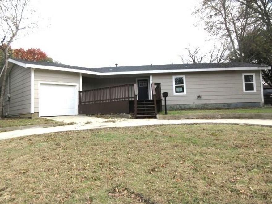 This four bedroom, two bath home is ready for your special touch to make it shine!  The entire home offers wood look flooring.  The kitchen features beautiful granite countertops, stainless sink, shaker style cabinets, smooth top electric stove, dishwasher, and built-in microwave!  Both bathrooms feature granite counters and beautiful white subway tile surrounds showers. The exterior is perfect for a large or growing family with plenty of outdoor space, with a private wood fence.  The front features a circular drive and one-car garage!