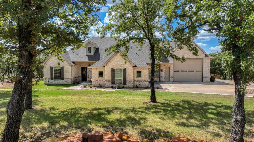From the moment you arrive you’ll notice special features & unique details not found in the typical home & the community is awesome too! The home is packed with features that make living in the home a dream. Located in a gated community loaded with amenities that enhance your lifestyle…things like hiking trails, workout facility, fishing lakes, riding stables & community lakefront clubhouse. When you arrive you’ll notice the beautiful stone & brick exterior is a timeless design. Circle drive & landscaping retaining walls add function & curb appeal. There is a two-car garage & massive attached third bay that provides enough room for even a large motor coach! With an epoxy garage floor finish, 50-amp plug, plumbed clean out & water connection the garage bay is perfect for your RV. Or if you have a hobby that needs space you are set…insulated walls, and the direct connection to the home that makes use so simple & convenient! And wait until you go inside the home…countersunk real hardwood floors, ceiling details, custom cabinets, beautiful countertops, quality appliances & more! As you enter through the iron front door you’ll notice a perfect office and full guest bath. On the right you’ll see the open dining room that connects to the great room with towering vaulted ceiling. The kitchen is spectacular with abundant custom cabinets & breakfast area. These spaces overlook the amazing back porch with fireplace, complemented by a 10+ mile vista view! Two guest bedrooms & a hall bathroom are located opposite from the owners suite for abundant privacy. Owner's suite has a huge shower, free standing tub & large walk in closet. Huge windows bring the beautiful view inside! A hot tub is situated below the back porch & will convey with the home. Home features a backup electric generator, rainwater catchment system and energy efficient spray foam design! This home has it all & provides more than just a place to live…it’s a lifestyle you’re investing in with this purchase!