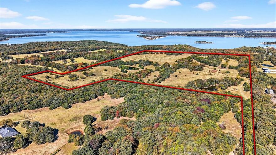 72.75 Acres of Lakefront Opportunity on Lake Texoma

Discover a rare chance to own 72.75+- acres of prime lakefront land on the shores of Lake Texoma, perfectly positioned adjacent to Corps of Engineers property with direct lake access by walking down to the beach. This exceptional tract combines wide-open potential with unparalleled natural beauty, making it ideal for farming, ranching, hunting, fishing, or creating your dream lake retreat.

Gently rolling terrain, panoramic water views, and vistas overlooking the lake’s iconic islands create an unbeatable backdrop for anything you envision. Whether you want to build a private getaway, develop a recreational haven, or operate a working ranch, this land offers true do-it-all versatility.

Opportunities like this are rare—experience freedom, privacy, and the best of lake life all in one extraordinary property on Lake Texoma.