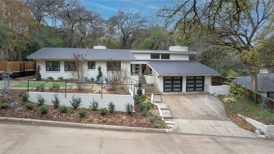 This stunning mid-century modern home has been thoughtfully renovated to blend timeless architectural character with fresh, sophisticated upgrades. Located in highly desirable Tanglewood, the property sits on an expansive lot with both a generous backyard and side yard—perfect for entertaining, outdoor dining, or future additions.  Step inside to a spacious living room anchored by a dramatic wall-to-wall fireplace, flanked by custom built-in couches that create a warm, inviting gathering space. The open living and dining areas offer panoramic views of the backyard, filling the home with natural light and seamless indoor–outdoor flow.  The fully renovated kitchen features modern cabinetry, quartz countertops, a striking waterfall island, and stylish finishes throughout—ideal for both everyday living and hosting.  With 3 bedrooms, 2 baths, and a dedicated office, the layout is both functional and flexible. Major improvements include a new AC system and roof, both replaced in 2022, new electrical panel, steel pivot doors, LED lighting and much more offering peace of mind and long-term value.  A rare Tanglewood gem—move-in ready, architecturally stunning, and designed for modern living.