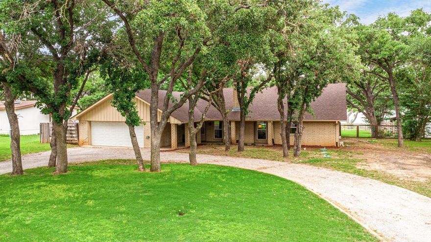 Fully Remodeled 3BR.2 Bath Lakefront Home on a Large Private Lot with Modern Upgrades throughout. New Windows, Custom Cabinets, Flooring, Granite, Upgraded Appliance, HVAC, Roof and Septic. Open layout with Lake Views and a Spacious Kitchen. Located just 1 Hr. 45 Min. from Ft. Worth with easy I-20 access.  This Property offers Quiet Rural Setting for Weekend Escapes. Outdoor Living features a Back Porch with Adjustable-Roof Pergola, Dedicated Fire Pit area, Mature Shade Trees, Fenced Yard for Kids and Pets, and Lighting that leads to the Shoreline. Enjoy Year-round usable Waterfront with Excellent Fishing plus easy Boating, Kayaking, and Paddle Boating. Two Auxiliary Buildings add Rare Flexibility: Lakefront Studio, Remodeled Boathouse with Glass Garage Door, Perfect for Home Office, Gym or Creative Space. Flex Buldling with Half Shed-Half Office with Climate Control and Storage. Property Supported by Coop Water, Reliable Power and High-Speed Starlink Internet. Fully Paved access from Major Cities to the Driveway. Ideal for Full Time Living, a Weekend Retreat or High Performing VBRO. With Thoughtful Design, The Property can Sleep up to 20 and offers Two Private Office Spaces for Remote Work or Multi-Family Stays.