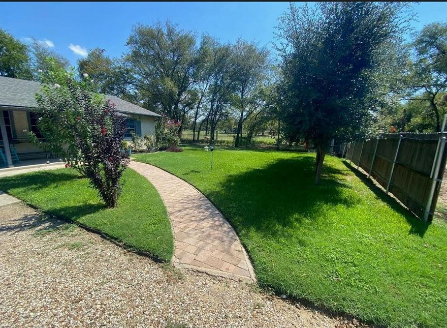 Charming Country Retreat Just Minutes from I-35

Welcome to your ideal blend of peaceful country living and convenient city access! Nestled on a beautiful tree-lined street, this inviting 3-bedroom, 2-bath home offers spacious living with room to grow and personalize. Outdoors, the possibilities are endless. The backyard features mature trees and an open space just waiting to be transformed into your dream entertaining area—imagine a patio, firepit, or outdoor kitchen designed just for you. A standout feature of this property is the detached garage workshop, fully equipped with a sink and workbench—ideal for hobbyists, mechanics, or those who need extra storage and project space. Located just 3 miles from I-35, you’ll enjoy quick access to town while coming home to the serenity of a country setting.

**More Pictures Coming Soon**