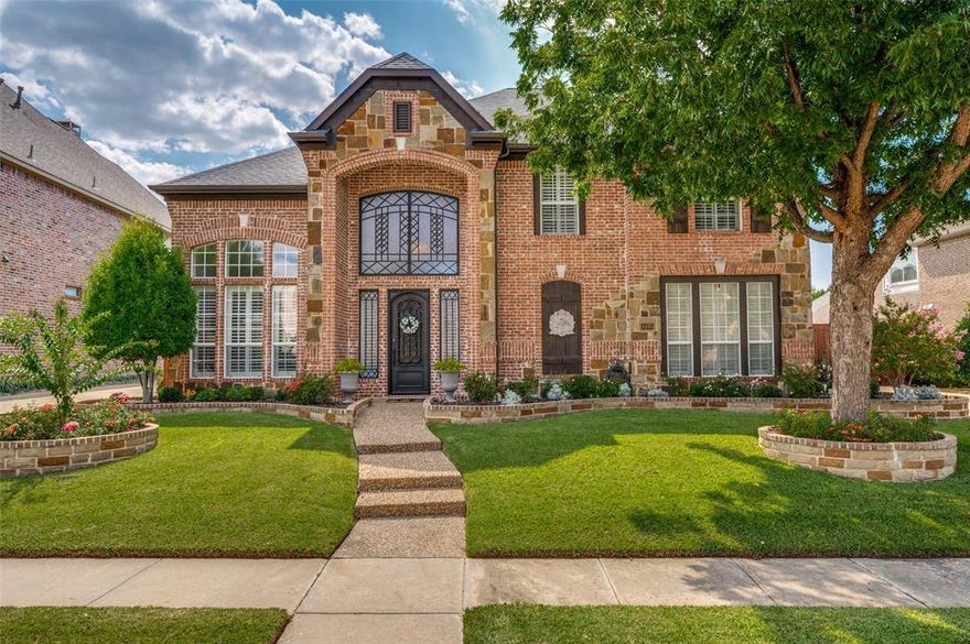 Beautifully updated 6 bedroom home in highly desirable Heritage Green & Frisco ISD with 3 car garage and resort style backyard that received a full remodel in 2022 with refinished sparkling pool, large covered cedar porch and outdoor kitchen! As you enter the home, you are greeted with high ceilings, light colors, extensive crown molding and millwork, formal living and dining with wood flooring and private wine room with built in shelving.  The wood flooring continues into the open concept main living area with 18 foot ceilings, built in shelving, gas fireplace with cast stone surround & two story wall of windows overlooking the private backyard & pool! The luxury kitchen has been completely remodeled in 2022 & includes granite countertops against a travertine backsplash, solid wood cabinets, two dishwashers, dual ovens, new tile flooring, designer lighting, center island & large bar area with extra seating! The private primary suite is tucked away at the back of the home to capture the exceptional pool view and features wood flooring and large bath with granite countertops, dual sinks, jetted tub, walk in shower with frameless glass door & large closet! Hard to find 2nd guest bathroom downstairs with full bath that could be used as a private office! The dual staircase with iron balusters leads upstairs to massive game room, private media room, additional living area, and 4 large bedrooms that each have direct access to ensuite jack and jill bathrooms! The backyard is the masterpiece of this home with newly refinished heated pool with waterfall features and tanning ledge, large covered porch, outdoor kitchen with built in gas grill and refrigerator, custom landscaping to enhance the beauty and privacy with no visibility from neighbors, 8 foot board on board cedar fence plus large grassy area and separate dog run!  3 car oversized garage with EV charger! Perfect Frisco location and within minutes from Dallas North Tollway, Highway 121, Stonebriar Mall and The Star!