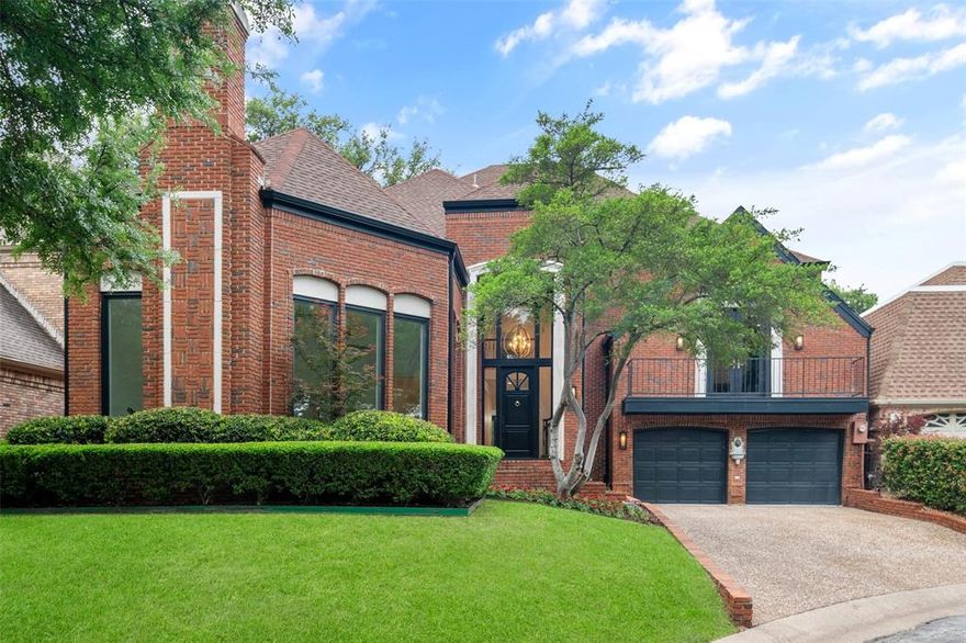 Tucked within a cul-de-sac in Bent Tree Royal, one of the area’s most prestigious golf course communities, this beautifully updated home offers a rare opportunity to enjoy the setting without the maintenance of a sprawling estate.  Set on a smaller, more manageable lot, the home backs to the golf course with views and enhanced privacy. Inside, rich wood floors and thoughtful updates maintain the home’s architectural character while adding a refined, modern feel. A grand entry makes an immediate impression, flanked by dual staircases – one leading to private bedroom wing with bedrooms and game room opening to balcony and the other to a secluded study that feels like a retreat of its own. The home offers defined living space that provides flexibility, separation, and a more traditional sense of flow. The kitchen makes a statement with large island, quartz countertops, sleek custom cabinetry, and a striking mix of Café and Bertazzoni appliances – blending performance with modern style. Designed for both entertaining and functionality, the kitchen features double ovens, wine fridge, a farmhouse sink, abundant storage and prep space. Coffered ceiling, designer lighting, and the sunlit breakfast area with brick fireplace create an inviting atmosphere for casual dining and gathering. The massive primary suite offers a comfortable retreat with golf course view, a sitting area, fireplace and a spacious bath with dual vanities, soaking tub and separate shower plus his and her closets.
It’s a distinctive home with its own personality – set in a location that speaks for itself.