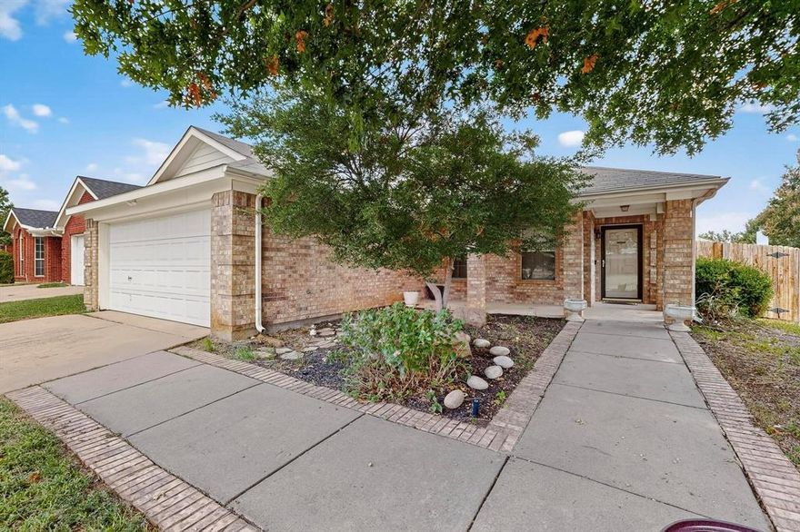 This home features front and back porches! Amazing open floorplan! Home features low maintence laminate flooring throughout, raised ceilings, spacious kitchen with built in island and raised breakfast bar! Wood burning fireplace in the kitchen and comfortable sitting area or formal dining room. Perfect for entertaining!  Primary suite features walk in closet, and primary bath has separate tub and shower with double sinks.  Secondary bathroom is ADA efficient with railing and chair int he shower. Lovely flagstone back porch with wood privacy fence.