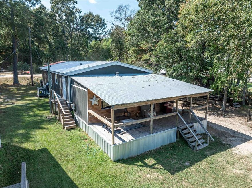 CALLENDER LAKE WATERFRONT HOME.  This charming 4 BR, 2 B, 1344 sq. foot Redman built doublewide home has a 275 sq. ft. additional room added for storage and 14x11 fourth bedroom. This gives the home  a total of approximately 1498 sq. feet of living space plus storage area.    Walk out onto your large 25x11 covered porch and enjoy the breath taking view of Callender Lake and your 10x16 waterfront dock.  This home has been updated with sheetrock walls, natural wood trim, wood beam in living room, luxury vinyl plank flooring, 18 month old metal roof, 2 month old AC-Heat system, updated master bath, metal skirting,  and fresh paint inside and outside and so much more.  There is also a two car detached carport at the front of the home.  The home is located in the gated community of Hickory Hills on the beautiful 365 acre spring fed Callender Lake.  Community features gated entrance, boat ramp, community pool, children's park, fishing pier, lake swim area, dumpsters for trash, restroom and shower facility located near pool, great fishing, swimming, and boating.  Come see this home today and start living the LAKE LIFE!