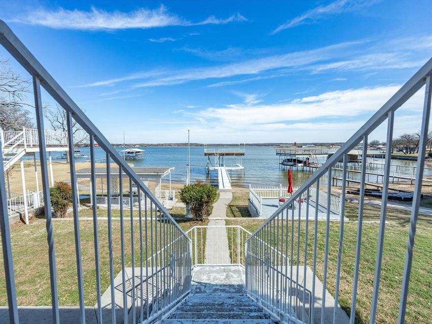 Its all about that OPEN WATER VIEW! Stunning remodeled colonial-style home situated on open water on Eagle Mountain Lake offering an exceptional balance of timeless character and modern updates. This property has had only one owner since it was built & has been freshly update and ready for its next chapter! The main home is a classic brick but could easily go modern with white exterior paint! The split-level floorplan is almost 2200 sq ft plus a bonus guest house that is approx 700 sq ft! 
The main level features a fresh kitchen, dining, sunroom & living room with brand new windows throughout that offer breathtaking views from every angle! This level also has 1 primary bedroom with gorgeous brand-new en-suite bath & a patio, 2 additional bedrooms plus 1 bath. The lower level is flexible & has been converted to a spacious 2nd master with en-suite bath, wood-burning stove and room for a sitting area!
Outdoor living is a central highlight of this property. Multiple covered decks provide expansive space for dining, gatherings, or quiet relaxation while overlooking wide, open-water views. The property also includes an awesome double-decker dock, offering direct access to the lake for boating, fishing, swimming, or enjoying the scenery. With generous waterfront access & unobstructed views, this home makes the most of its prime location.
The property also includes a guest house complete with kitchen & bath, and extra storage!

Practical features include a spacious 2 car garage with 2 storage rooms & additional covered parking. The home has been thoughtfully updated & maintained, creating a move-in-ready opportunity for those seeking a full-time lakefront residence or a weekend retreat. With its blend of updated finishes, versatile spaces, & premier water access, 11314 Stanfield Drive represents a rare chance to enjoy the lakefront lifestyle in comfort & style. 
NO HOA & County taxes mean lower tax rate and more personal freedom to enjoy your own piece of PARADISE!