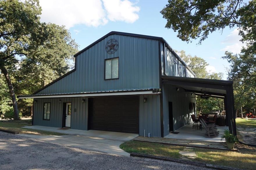 Beautiful Barndominium that sits on over 12 wooded acres in the country! This one won't last long as it has been priced to sell! 2130 sq ft. This home is a TRUE red iron i-beam steel construction residence that will be here from now on..!! Built in 2021, & neat as a pin! Top notch appliances & finishes thru out! Granite tops thru out! Gas cook range! Each bedroom has it's own full bath! High end tile showers! Rolling wooded acreage with wildlife abounding! In coveted CRISD! Property fenced all the way around, and even a wildlife proof fenced in garden area! 20x40 RV shed, & 20x20 tractor carport! The 2 RV spaces on property have full utility hook-ups! Storage building also has power & plumbing! Property has 2 entrances, and one with fully electronic wrought iron gate! Perfect for those seeking a quiet place in the country! Or even great for those who'd like to hunt deer & other wildlife on their own property! Come take a look - you'll be impressed!